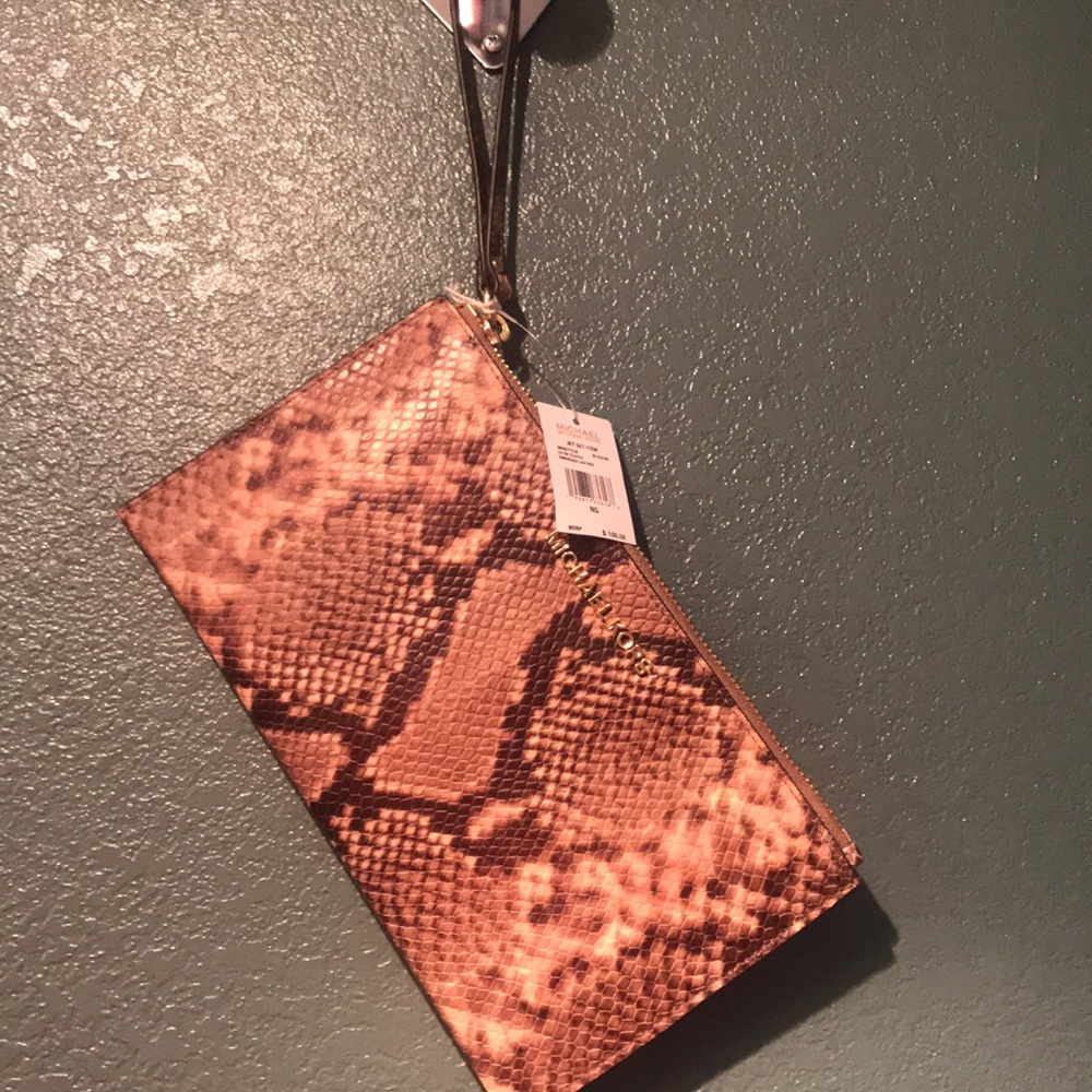Sold MIchael Kors blossom snakeskin large wristlet
